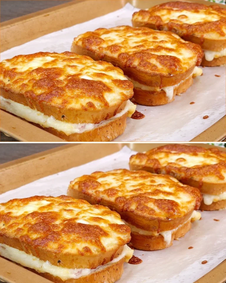 Sandwich con uova, formaggio e prosciutto per colazione veloce.